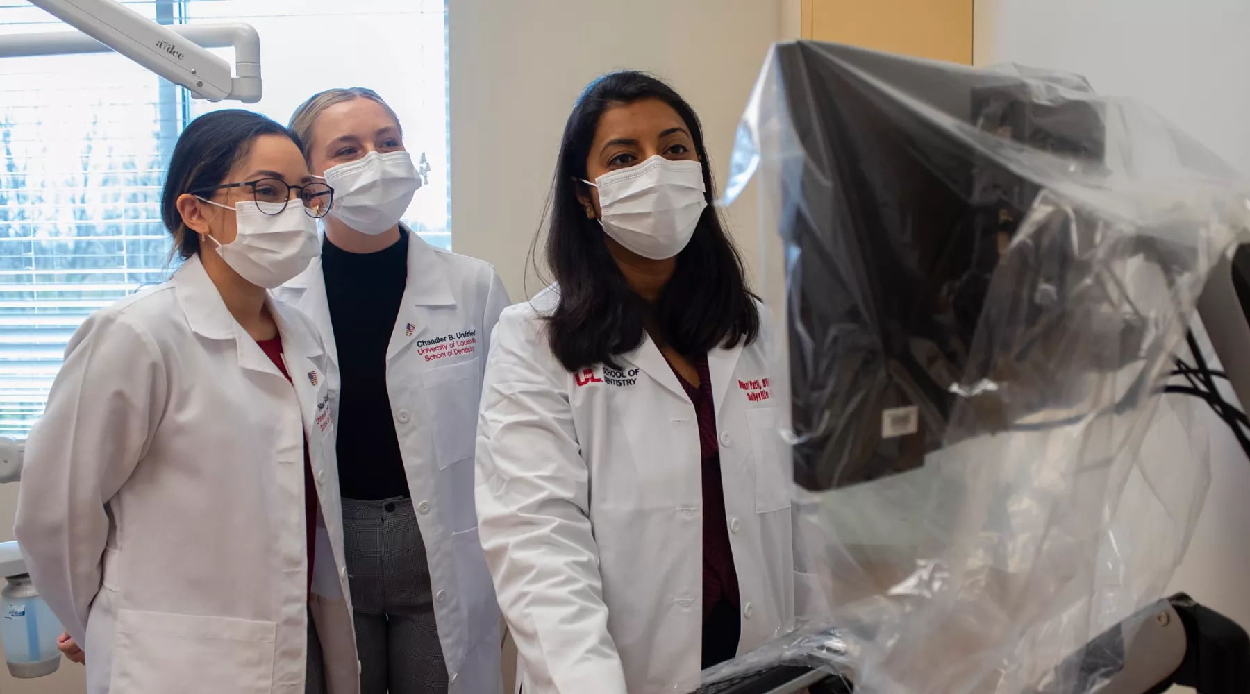 UofL Dental Clinic in Shelbyville, KY..Dental third year students Nissa Siddigi & Chandler Unfried .with Dentist